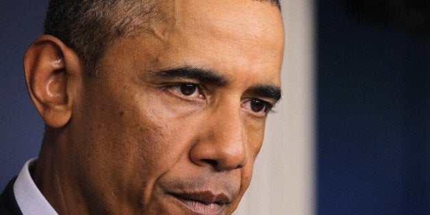 WASHINGTON, DC - AUGUST 18: U.S. President Barack Obama makes a statement in the James Brady Press Briefing Room of the White House August 18, 2014 in Washington, DC. Obama returned early from his vacation in Martha's Vineyard to hold meetings with his national security team and also with U.S. Attorney General Eric Holder in regards to the situation in Iraq and the continuing violence in Ferguson, Missouri. (Photo by Alex Wong/Getty Images)