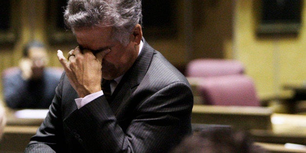 Arizona state Sen. John Huppenthal, R-District 20, pauses during a special session in the Arizona Senate at the state capitol Thursday, Nov. 19, 2009, in Phoenix. The legislature is extending its special session after the Senate narrowly rejected a bill to cut funding for K-12 schools and Department of Economic Security social programs. (AP Photo/Ross D. Franklin)