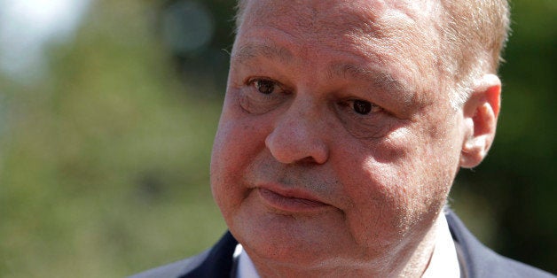 Arizona Attorney General Tom Horne talks to a reporter outside the 9th U.S. Circuit Court of Appeals in Pasadena, Calif., Tuesday, June 21, 2011. The latest court battle between Arizona and the federal government is being fought in a Pasadena, Calif., courtroom where an appeals court will hear arguments Tuesday on whether the state can require proof of citizenship to register to vote. (AP Photo/Jae C. Hong)