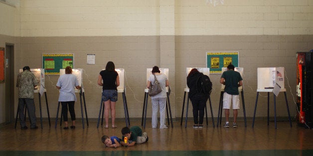 LOS ANGELES, CA - NOVEMBER 6: People vote at a school in the predominantly Latino Boyle Heights area during the U.S. preside
