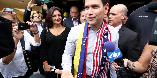 DORAL, FL - FEBRUARY 28: U.S. Senator Marco Rubio (R-FL) walks out of the El Arepzo 2 restaurant on February 28, 2014 in Doral, Florida. Rubio and Florida Governor Rick Scott held a meet and greet with the Venezuelan community to discuss the ongoing crisis in Venezuela. (Photo by Joe Raedle/Getty Images)