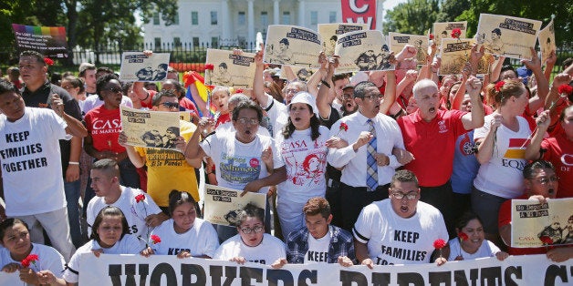 WASHINGTON, DC - AUGUST 28: More than 300 demonstrators marched from the Immigration and Customs Enforcement headquarters to rally outside the White House and demand that President Barack Obama halt deportations August 28, 2014 in Washington, DC. Organized by CASA of Maryland, about 120 of the protesters were arrested after refusing to clear the sidewalk on the north side of the White House. (Photo by Chip Somodevilla/Getty Images)