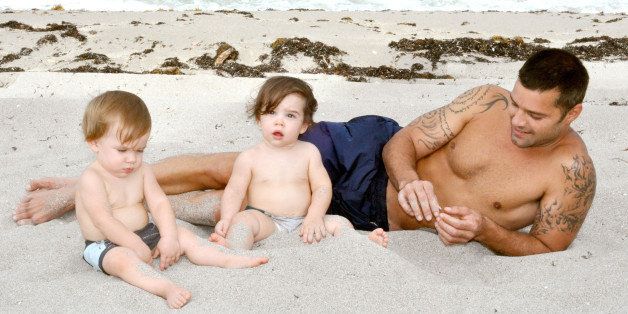 MIAMI - AUGUST 18: In this handout image provided by Ricky Martin, Ricky Martin poses with his sons Valentino and Matteo on August 18, 2009 in Miami, Florida. (Photo by Pablo Alfaro/Ricky Martin via Getty Images)