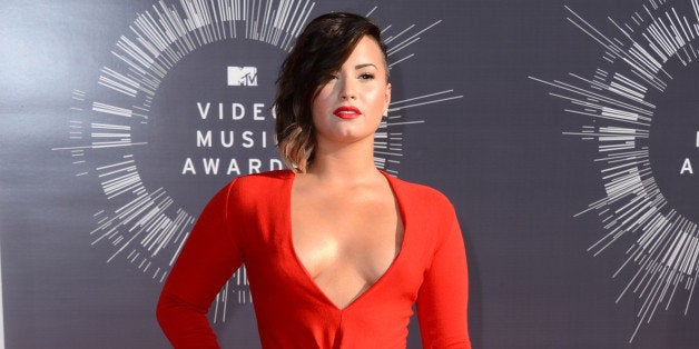 Demi Lovato arrives at the MTV Video Music Awards at The Forum on Sunday, Aug. 24, 2014, in Inglewood, Calif. (Photo by Jordan Strauss/Invision/AP)