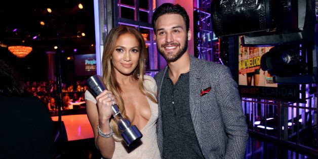 BEVERLY HILLS, CA - DECEMBER 18: Actress-singer Jennifer Lopez (L) and actor Ryan Guzman pose with the Triple Threat award backstage during the PEOPLE Magazine Awards at The Beverly Hilton Hotel on December 18, 2014 in Beverly Hills, California. (Photo by Chris Polk/PMA2014/Getty Images for dcp)