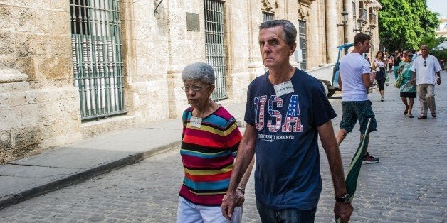 A Cuban wearing a t-shirt with the US flag walks along a street of Havana, on January 16, 2015. The United...