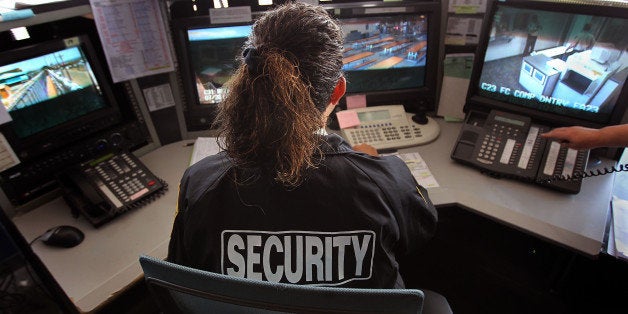 FLORENCE, AZ - JULY 30: A guard monitors surveillance cameras inside the U.S. Immigration and Customs Enforcement (ICE) detention facility for illegal immigrants on July 30, 2010 in Florence, Arizona. Most immigrants at the center are awaiting deportation or removal and return to their home countries, while some are interned at the facility while their immigration cases are being reviewed. ICE in Arizona holds almost 3,000 immigrants statewide, all at the detention facilities in Florence and nearby Eloy. Arizona, which deports and returns more illegal immigrants than any other state, is currently appealing a judge's ruling suspending controversial provisions of Arizona's immigration enforcement law SB 1070. (Photo by John Moore/Getty Images)