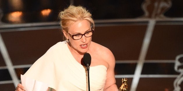 Winner for Best Supporting Actress Patricia Arquette accepts her award on stage at the 87th Oscars February 22, 2015 in Hollywood, California. AFP PHOTO / Robyn BECK (Photo credit should read ROBYN BECK/AFP/Getty Images)