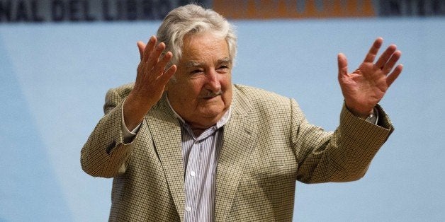 Uruguayan President Jose Mujica waves after participating in a conference on the last day of the International Book Fair in Guadalajara, Mexico, on December 7, 2014. Argentina is this year's Guest of Honour Country at the Guadalajara Fair, the largest in the Spanish-language world. AFP PHOTO/Hector Guerrero (Photo credit should read HECTOR GUERRERO/AFP/Getty Images)