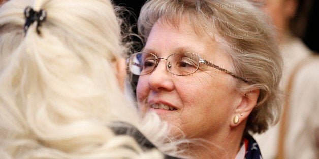 Arizona Republican candidate for State Superintendent Diane Douglas, right, talks with a supporter at the Republican election