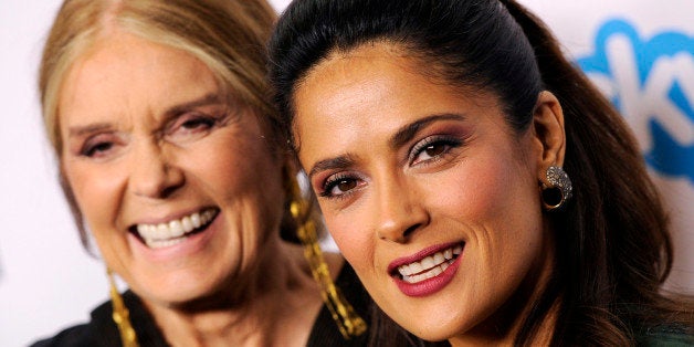 Honorees Gloria Steinem, left, and Salma Hayek Pinault pose together at the "Make Equality Reality" event at the Montage Hotel on Monday, Nov. 3, 2014, in Beverly Hills, Calif. (Photo by Chris Pizzello/Invision/AP)