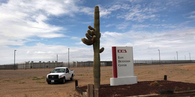 ELOY, AZ - JULY 30: A cactus and sign mark the entrance to the Eloy Detention Facility for illegal immigrants on July 30, 2010 in Eloy, Arizona. Most immigrants at the center, operated by the Corrections Corporation of America (CCA), are awaiting deportation or removal and return to their home countries, while some are interned at the facility while their immigration cases are being reviewed. The U.S. Immigration and Customs Enforcement (ICE), in Arizona holds almost 3,000 immigrants statewide, all at the detention facilities in Eloy and nearby Florence. Arizona, which deports and returns more illegal immigrants than any other state, is currently appealing a judge's ruling suspending controversial provisions of Arizona's immigration enforcement law SB 1070. (Photo by John Moore/Getty Images)