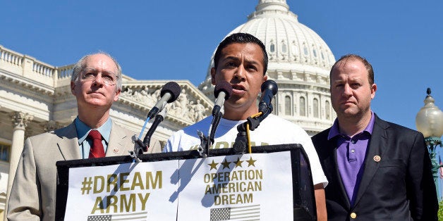 DREAM Action Coalition Co-Director Cesar Vargas, joined by Rep. Bill Foster, D-Ill., left, and Rep. Jared Polis, D-Colo., right, speaks during a news conference on Capitol Hill in Washington, Friday, July 25, 2014, calling on the Department of Defense to allow "DREAMERs" to serve in the military. (AP Photo)