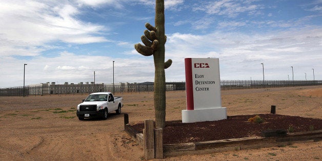 ELOY, AZ - JULY 30: A cactus and sign mark the entrance to the Eloy Detention Facility for illegal immigrants on July 30, 2010 in Eloy, Arizona. Most immigrants at the center, operated by the Corrections Corporation of America (CCA), are awaiting deportation or removal and return to their home countries, while some are interned at the facility while their immigration cases are being reviewed. The U.S. Immigration and Customs Enforcement (ICE), in Arizona holds almost 3,000 immigrants statewide, all at the detention facilities in Eloy and nearby Florence. Arizona, which deports and returns more illegal immigrants than any other state, is currently appealing a judge's ruling suspending controversial provisions of Arizona's immigration enforcement law SB 1070. (Photo by John Moore/Getty Images)