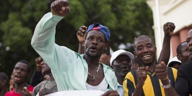 Haitian sugar cane workers march to the National Palace in Santo Domingo to protest about the deadline to enter the National