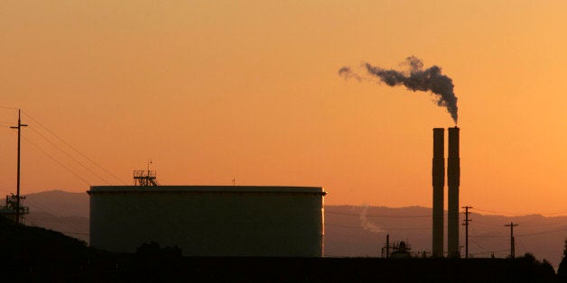 The Conoco Oil Refinery, in Rodeo, Calif. is seen at sunset, in file photo taken Friday, Sept. 22, 2006. In 2006 the state legislature passed a bill making California the first state in the nation to limit greenhouse gas emissions from power plants, oil refineries and other industries.(AP Photo/Rich Pedroncelli, file)