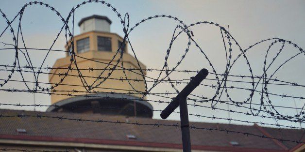 Barbed wire around prison walls