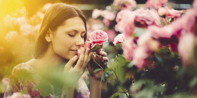 Pretty beauty smelling roses