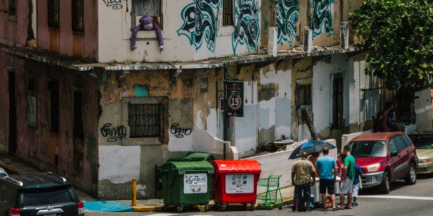 Graffiti is seen on the walls of a building in the Old City of San Juan, Puerto Rico, on Wednesday, July 8, 2015. A growing n