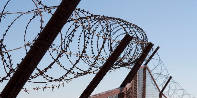 Security with a barbed wire fence photo. Protection concept design.