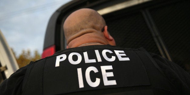 LOS ANGELES, CA - OCTOBER 14: U.S. Immigration and Customs Enforcement (ICE), agents detain an immigrant on October 14, 2015