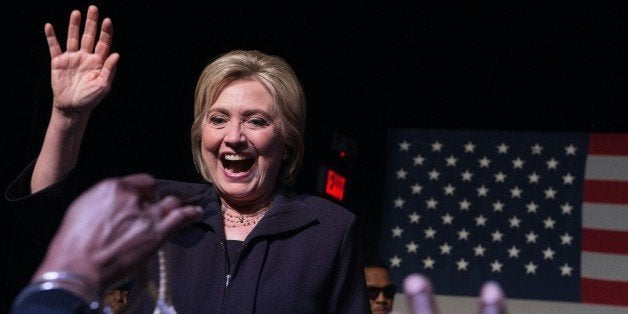 US Democratic presidential candidate Hillary Clinton waves to the crowd after making an appearance on stage at the Music Farm in Charleston, South Carolina, on February 25, 2016 during a concert by singer Charlie Wilson. Democrats will vote in the South Carolina primary on February 27. / AFP / Nicholas Kamm (Photo credit should read NICHOLAS KAMM/AFP/Getty Images)