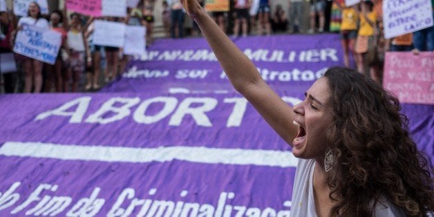 Brazilian women demonstrate in favor of abort legalization and against the president of the Brazilian Chamber of Deputies, Eduardo Cunha, in Rio de Janeiro downtown on November 11, 2015.AFP PHOTO / CHRISTOPHE SIMON (Photo credit should read CHRISTOPHE SIMON/AFP/Getty Images)