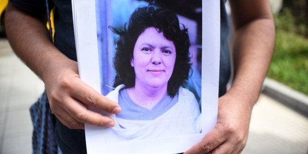 And human rights activist protests against the murder of Honduran environmental activist Berta Caceres in the outskirts of the embassy of Honduras in Guatemala on March 3, 2016. Caceres, a respected environmentalist who won the prestigious Goldman Prize last year for her outspoken advocacy, was murdered in her home Thursday, her family said. AFP PHOTO/ Johan ORDONEZ / AFP / JOHAN ORDONEZ (Photo credit should read JOHAN ORDONEZ/AFP/Getty Images)