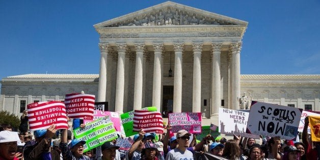 WASHINGTON, USA - APRIL 18: Pro-immigration supporters gather outside of the Supreme Court which was hearing arguments of President Obama's immigration plan this morning in Washington, USA on April 18, 2016. (Photo by Samuel Corum/Anadolu Agency/Getty Images)