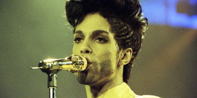 Prince performs during his 'Diamonds and Pearls Tour' at the Earl's Court Arena in London, Britain, June 15, 1992. REUTERS/