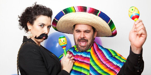 Studio Shot of two people dressed up as Mexicans