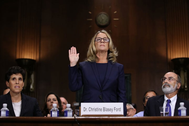 Christine Blasey Ford is sworn in Thursday before the Senate Judiciary Committee in the Dirksen Senate Office Building on Capitol Hill.