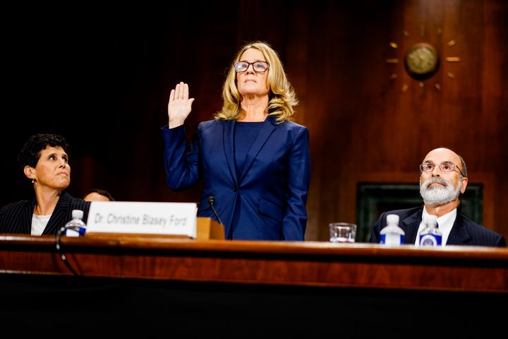 Christine Blasey Ford is sworn in before a Senate Judiciary Committee hearing on Thursday. She said that Brett Kavanaugh, now a Supreme Court nominee, sexually assaulted her when they were teenagers.