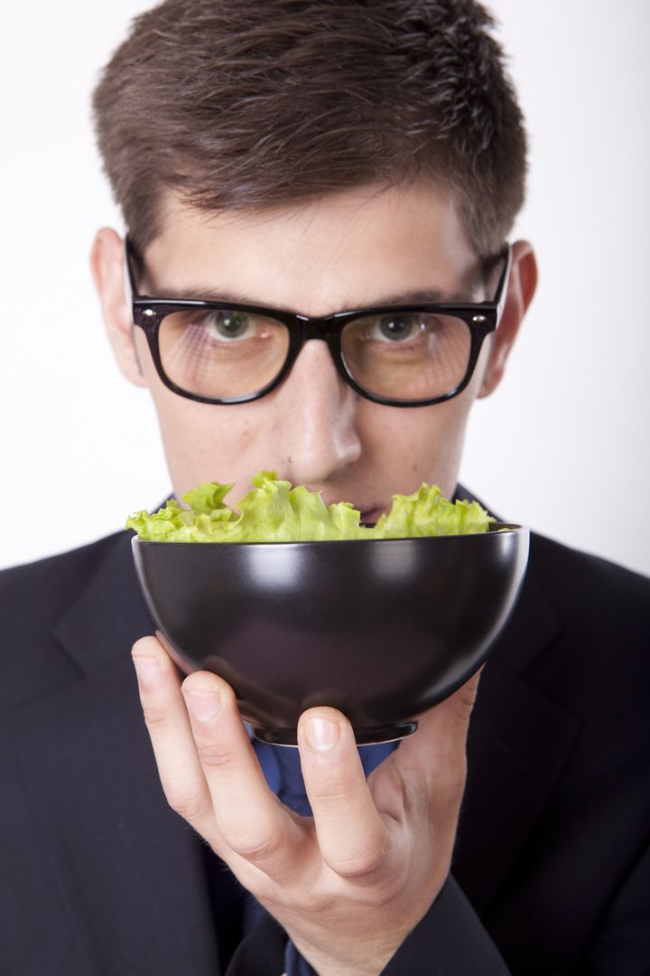 young man looking at the salad.