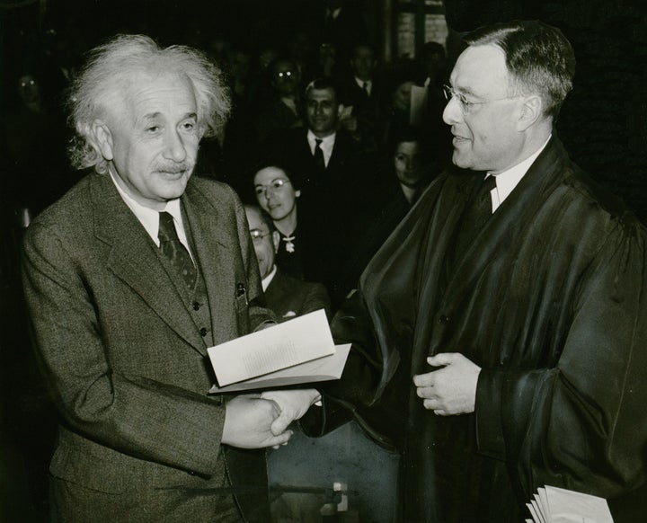 Photograph shows Albert Einstein receiving from Judge Phillip Forman his certificate of American citizenship. | Source Library of ...