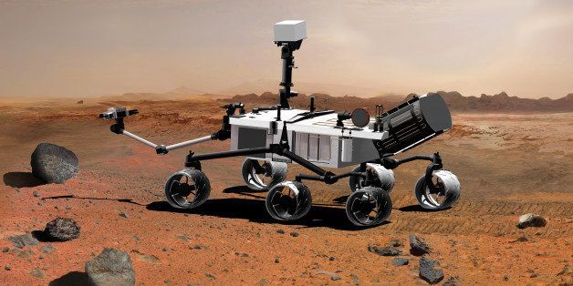 Artist's conception of NASA's Mars Science Laboratory Rover, currently under development, seen from a side aft angle. The arm extending from the front of the rover is designed both to position some of the rover's instruments onto selected rocks or soil tar