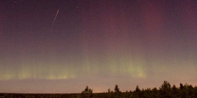 View of a shooting star (Draconid) and northern light near Skekarsbo at the Farnebofjardens national park 150 kilometers north of Stockholm, late on October 8, 2011. AFP PHOTO SCANPIX P-M Heden ** SWEDEN OUT ** (Photo credit should read P-M HEDEN/AFP/Getty Images)