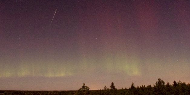 View of a shooting star (Draconid) and northern light near Skekarsbo at the Farnebofjardens national park 150 kilometers nort