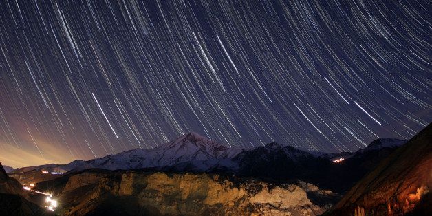 IRAN - SEPTEMBER 07: Star trails, a Quadrantid meteor, the trail of the Hubble Space Telescope, all above Mount Damavand in Alborz range of Iran on the early morning of 2009 January 4. (Photo by Babek Tafreshi/SSPL/Getty Images)
