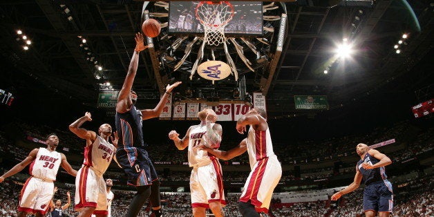 MIAMI, FL - April 20: Al Jefferson #25 of the Charlotte Bobcats shoots against the Miami Heat during Game One of the Eastern Conference Quarterfinals of the 2014 NBA playoffs at the American Airlines Arena in Miami, Florida on April 20, 2014. NOTE TO USER: User expressly acknowledges and agrees that, by downloading and/or using this photograph, user is consenting to the terms and conditions of the Getty Images License Agreement. Mandatory copyright notice: Copyright NBAE 2014 (Photo by Nathaniel S. Butler/NBAE via Getty Images)