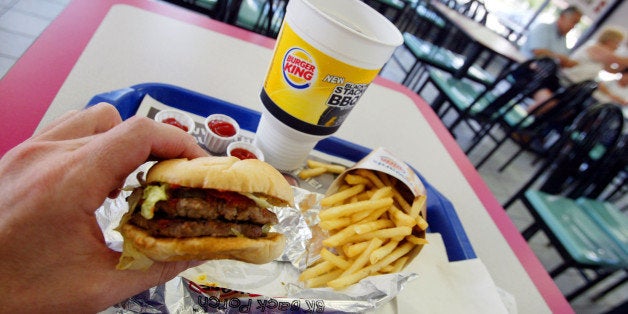 MIAMIL - JULY 18: A double hamburger with a King Fries and a King size Coke is seen on July 18, 2002 at a Burger King in Miami, Florida. The health effects of an American diet of super-sized fast foods are becoming apparent as increasing numbers of children and adults are being treated for obesity. Studies seem to point to the fact that many overweight children and adults get a large portion of their calories by consuming too many sodas and sweetened juices and beverages. Sweetened drinks + 'super-sized' meals + the convenience of fast food + a decrease in physical activity = a recipe for obesity. (Photo by Joe Raedle/Getty Images)