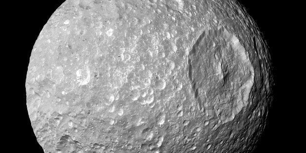 Saturn's moon Mimas. The large Herschel Crater dominates Mimas. Cassini. (Photo by: Universal History Archive/UIG via Getty I
