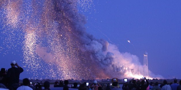 An unmanned rocket owned by Orbital Sciences Corporation explodes October 28, 2014 just seconds after launch from Wallops Isl
