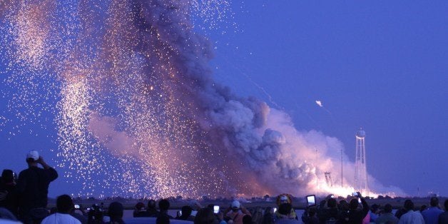 An unmanned rocket owned by Orbital Sciences Corporation explodes October 28, 2014 just seconds after launch from Wallops Island, Virginia, on what was to be a resupply mission to the International Space Station. 'The Antares rocket suffered an accident shortly after lift-off,' NASA mission control in Houston said, describing the blast as a 'catastrophic anomaly.' MANDATORY CREDIT: AFP PHOTO / Steve ALEXANDER (Photo credit should read STEVE ALEXANDER/AFP/Getty Images)