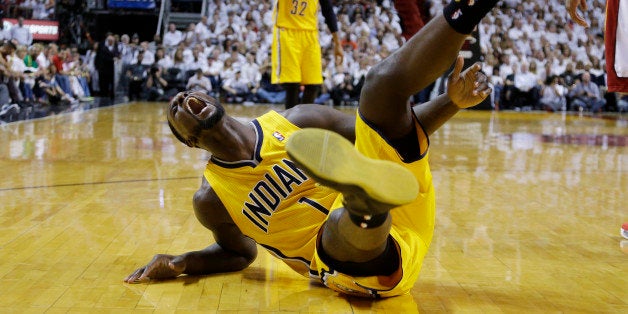 Indiana Pacers guard Lance Stephenson (1) yells after he fell hard following a foul from Miami Heat center Chris Bosh during