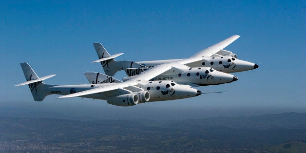 Virgin Galactic's private SpaceShipTwo spacecraft flies over the San Francisco Bay in San Francisco, California, U.S., on Wednesday, April 6, 2011. Virgin Group Ltd. Founder and Chairman Richard Branson said he intends to remain a 'major shareholder' in his Virgin Atlantic Airways Ltd. as his bankers review the airline's future and he seeks a partner to compete with British Airways. Photographer: David Paul Morris/Bloomberg via Getty Images