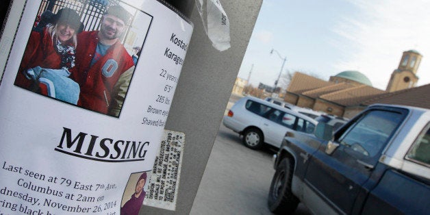 A flyer for Ohio State football player Kosta Karageorge hangs on a pole near The Annunciation Greek Orthodox Cathedral where his funeral is being held Wednesday, Dec. 3, 2014, in Columbus, Ohio. Karageorge, who had been missing for several days, was found dead Sunday, Nov. 30. (AP Photo/Jay LaPrete)