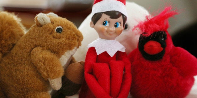 After a long day of mischief, this Elf is hiding among stuffed animals.