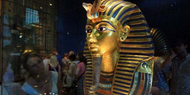 (FILES) -- A picture taken on October 20, 2009 shows King Tutankhamun's golden mask displayed at the Egyptian museum in Cairo. DNA testing has unraveled some of the mystery surrounding the birth and death of pharaoh king Tutenkhamun, revealing his father was a famed monotheistic king and ruling out Nefertiti as his mother, Egypt's antiquities chief said on February 17, 2010. AFP PHOTO/KHALED DESOUKI (Photo credit should read KHALED DESOUKI/AFP/GettyImages)