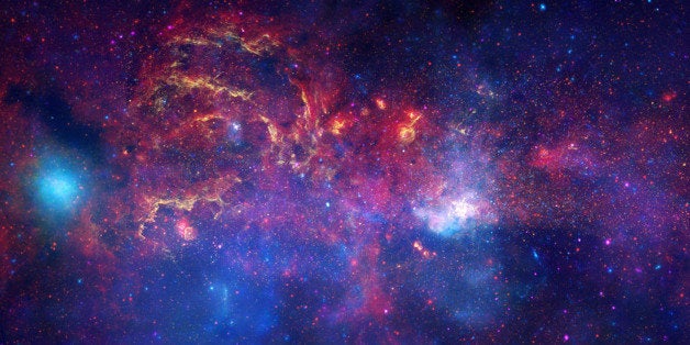 This image provided by NASA Tuesday Nov. 11, 2009 shows observations from the Hubble Space Telescope, the Spitzer Space Telescope, and the Chandra X-ray Observatory in a collaboration to produce an unprecedented image of the central region of our Milky Way galaxy using infrared light and X-ray light to see through the obscuring dust and reveal the intense activity near the galactic core. Note that the center of the galaxy is located within the bright white region to the right of and just below the middle of the image. The entire image width covers about one-half a degree, about the same angular width as the full moon. Each telescope's contribution is presented in a different color. Yellow represents the near-infrared observations of Hubble. The observations outline the energetic regions where stars are being born as well as reveal hundreds of thousands of stars. Red represents the infrared observations of Spitzer. The radiation and winds from stars create glowing dust clouds that exhibit complex structures from compact, spherical globules to long, stringy filaments. Blue and violet represent the X-ray observations of Chandra. X-rays are emitted by gas heated to millions of degrees by stellar explosions and by outflows from the supermassive black hole in the galaxy's center. The bright blue blob on the left side is emission from a double star system containing either a neutron star or a black hole. (AP Photo/NASA) When these views are brought together, this composite image provides one of the most detailed views ever of our galaxy's mysterious core.